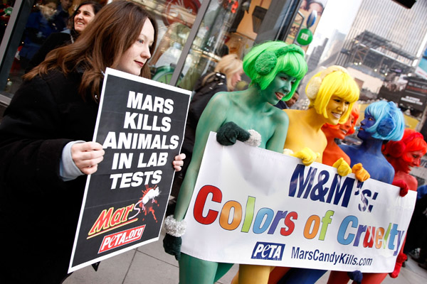 nude protest in front of the M&M's World Headquarters in New York's Time Square
