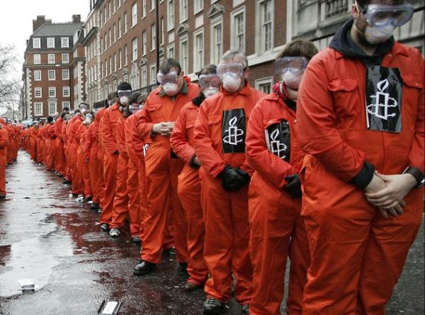 amnesty international participate in a protest calling for the closure of Guantanamo Bay