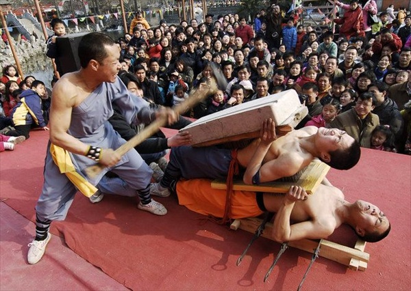 Stuntmen perform in a park to celebrate Chinese New Year in Xiangfan