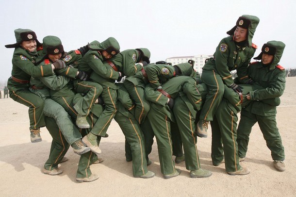 Paramilitary recruits during a training break at an army base in Shenyang, Liaoning province