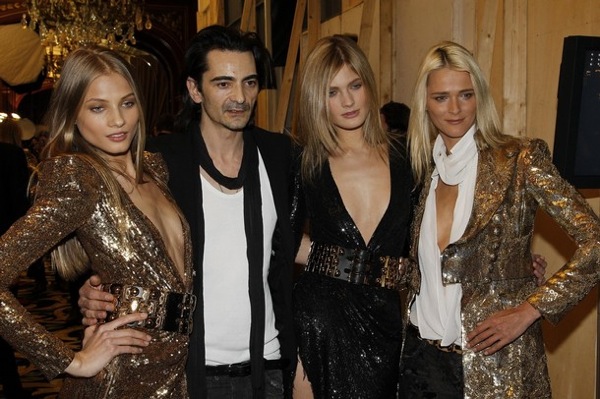 Balmain fashion designer Christophe Decarnin with models