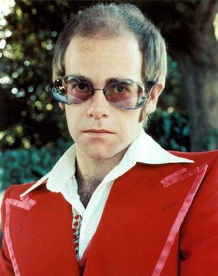 Elton John in red suite.jpg