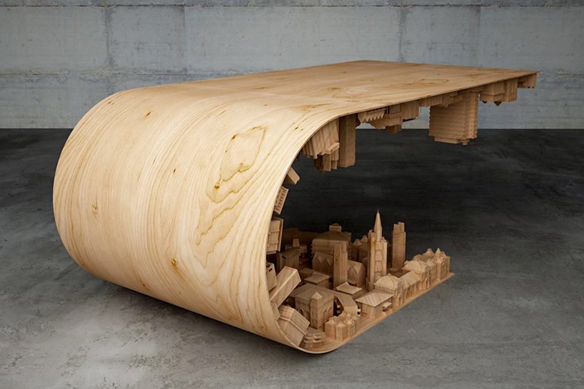 Согнутый стол с городским 3D-ландшафтом. ФОТО
